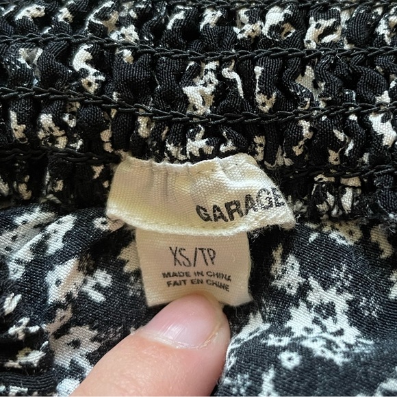 Garage black and white floral mini skirt. Says XS but it fit like a small. - Picture 2 of 2